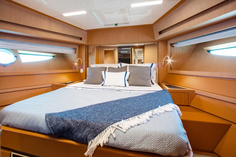 Lady Elkie Yacht Photos Pics Luxurious cabin interior of 2016 Riva 88' Florida yacht with elegant bedding.
