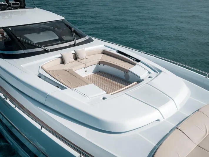 Lady Elkie Yacht Photos Pics Luxurious 2016 Riva 88' Florida yacht with elegant deck seating on calm waters.