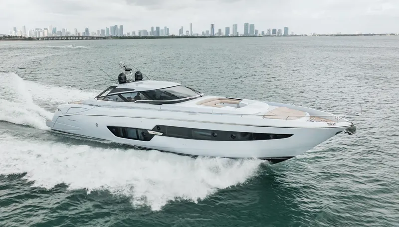 Lady Elkie Yacht Photos Pics Luxury Riva 88' Florida yacht cruising on open water, 2016 model.