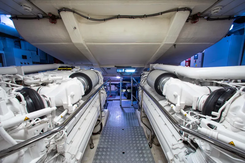 Lady Elkie Yacht Photos Pics Engine room of 2016 Riva 88' Florida yacht, showcasing dual engines and mechanical components.