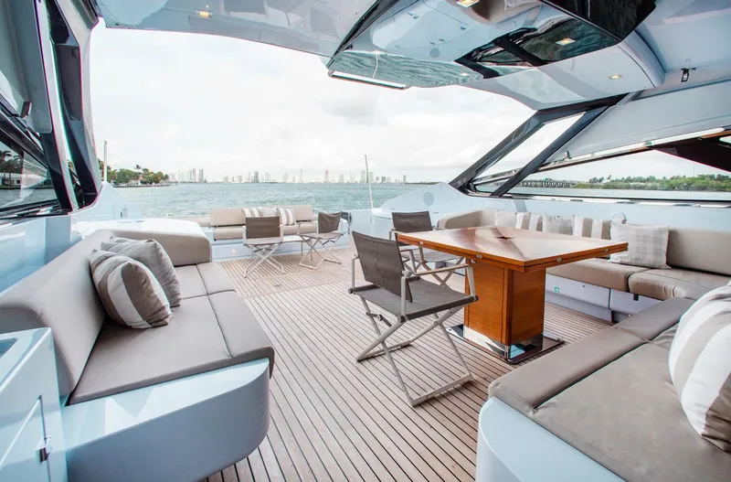 Lady Elkie Yacht Photos Pics Luxurious 2016 Riva 88' Florida yacht deck with elegant seating and ocean view.