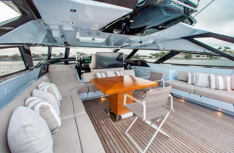 Lady Elkie Yacht Photos Pics Luxurious 2016 Riva 88' Florida yacht interior with elegant seating and wooden table.