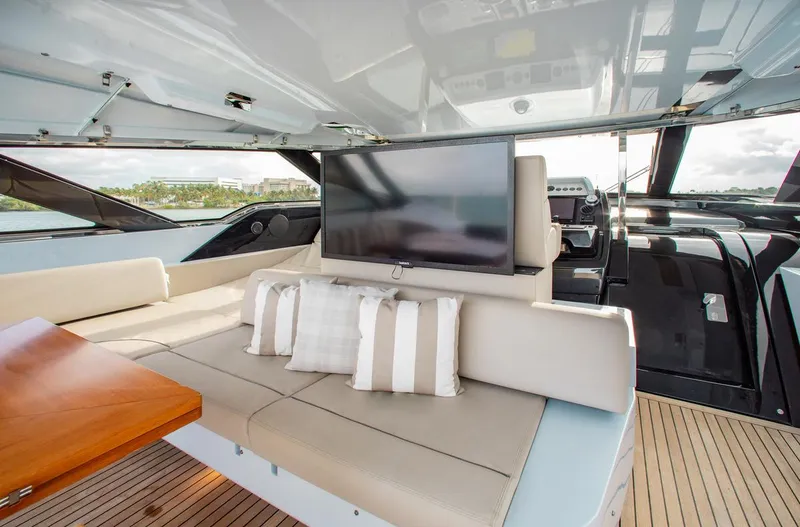 Lady Elkie Yacht Photos Pics Luxurious interior of 2016 Riva 88' Florida yacht with plush seating and TV.