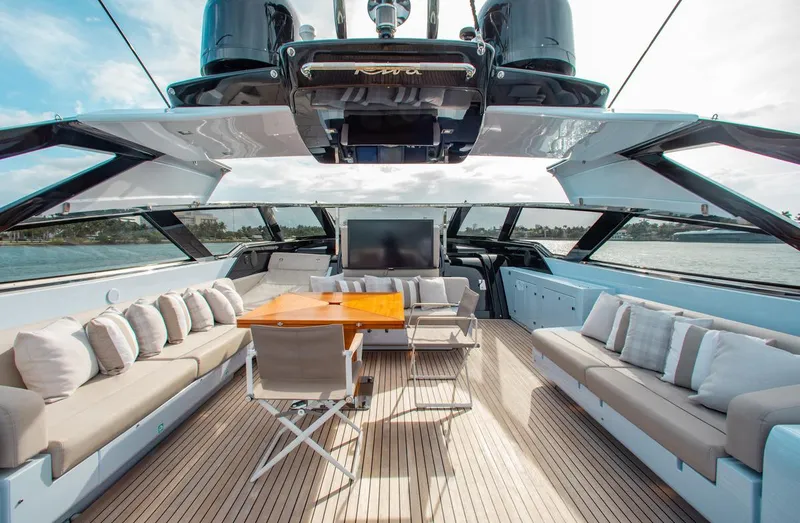 Lady Elkie Yacht Photos Pics Luxurious 2016 Riva 88' Florida yacht interior with elegant seating and wooden table.