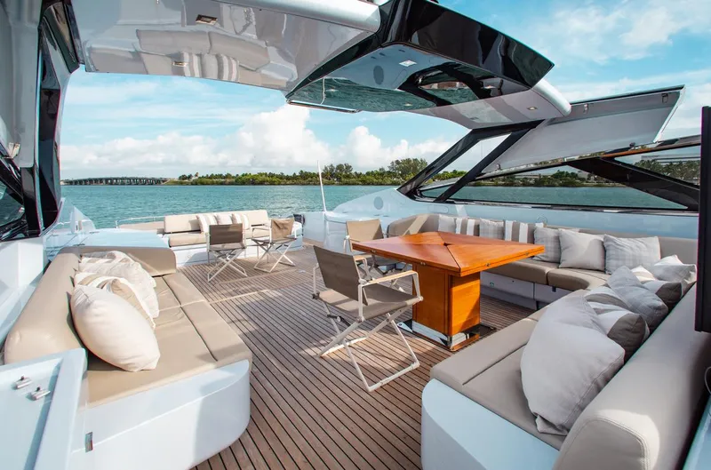 Lady Elkie Yacht Photos Pics Luxurious 2016 Riva 88' Florida yacht deck with elegant seating and ocean view.