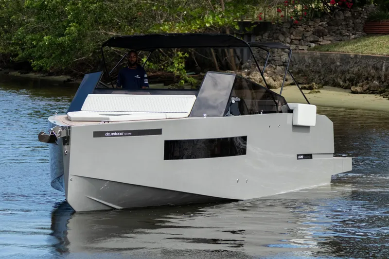  Yacht Photos Pics 2024 De Antonio Yachts D28 Cruiser on a serene waterway, showcasing sleek design and modern features.