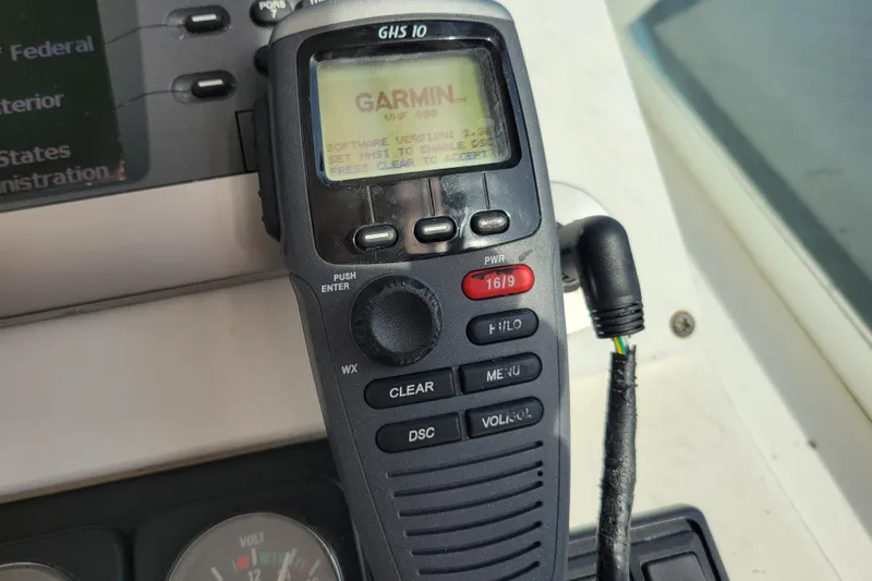 Reely Blessed Yacht Photos Pics Garmin GHS 10 marine radio on 1998 Cabo 31 Express boat dashboard.