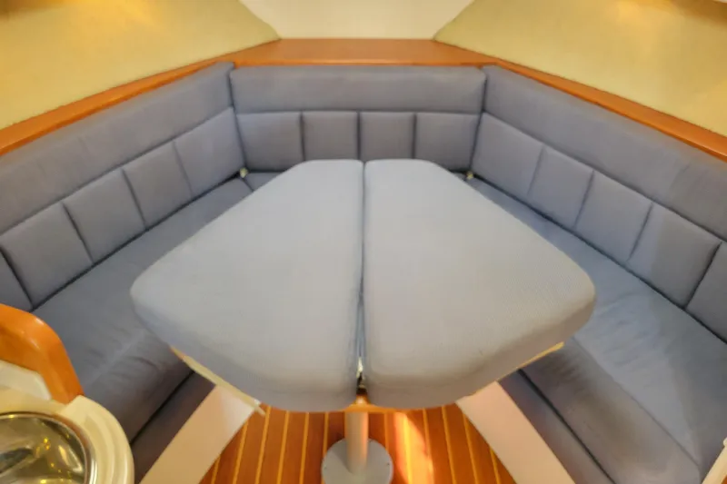 Reely Blessed Yacht Photos Pics Interior of 1998 Cabo 31 Express with Tower, featuring a cozy seating area.