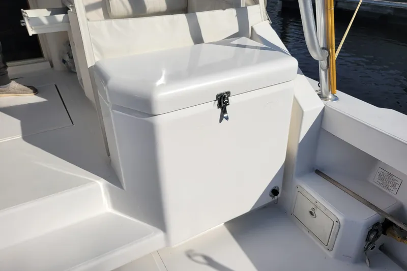 Reely Blessed Yacht Photos Pics 1998 Cabo 31 Express with Tower, featuring a white deck and storage compartment.