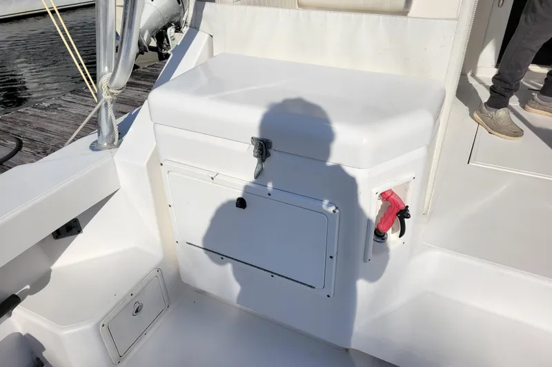 Reely Blessed Yacht Photos Pics 1998 Cabo 31 Express boat deck with storage compartment and shadow.