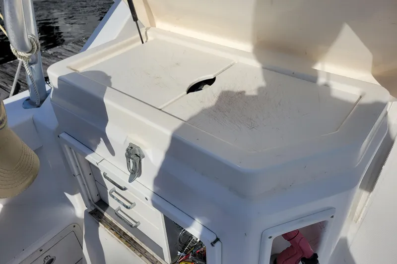 Reely Blessed Yacht Photos Pics 1998 Cabo 31 Express boat with tower, featuring storage compartments and a work surface.