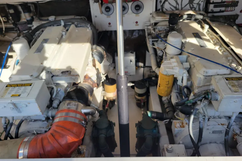 Reely Blessed Yacht Photos Pics Engine room of a 1998 Cabo 31 Express with Tower, showcasing dual engines and components.