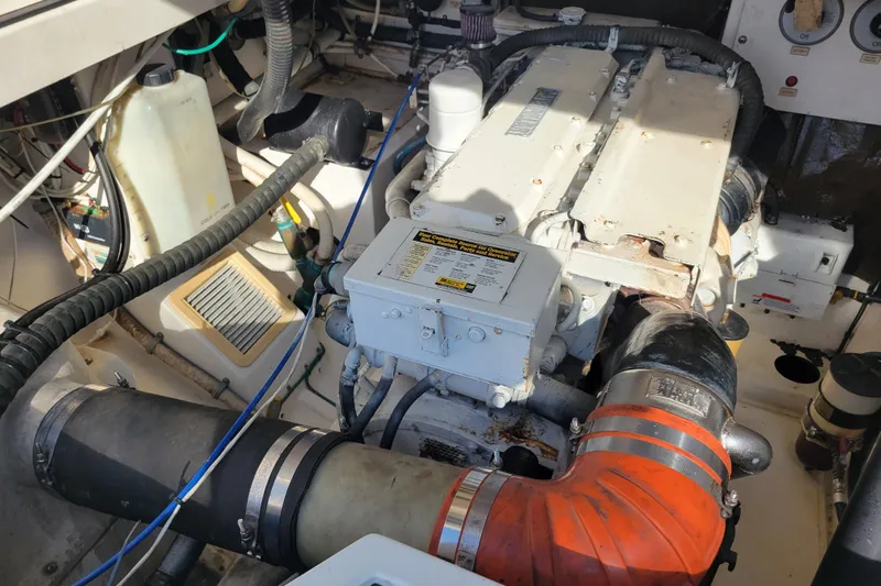 Reely Blessed Yacht Photos Pics Engine compartment of a 1998 Cabo 31 Express with Tower, showcasing mechanical components.