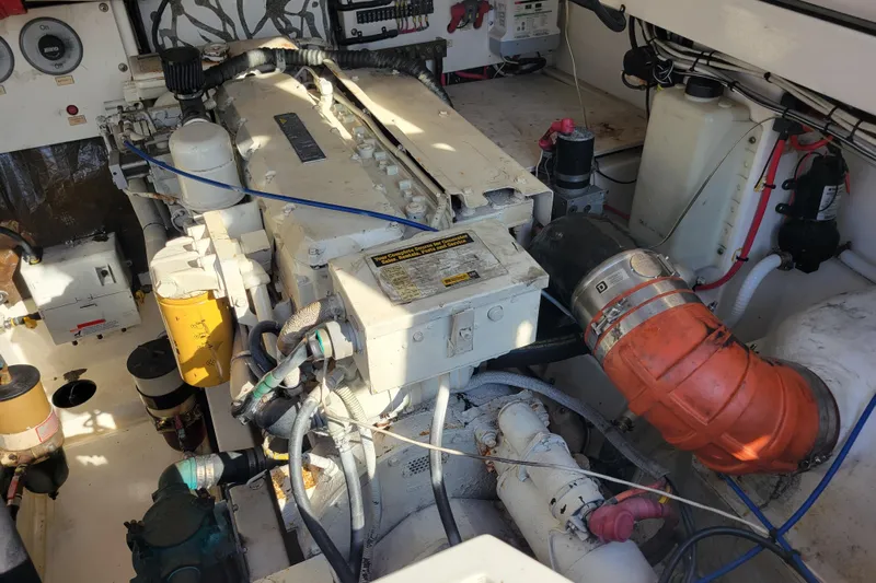 Reely Blessed Yacht Photos Pics Engine room of 1998 Cabo 31 Express with Tower, showcasing mechanical components and wiring.