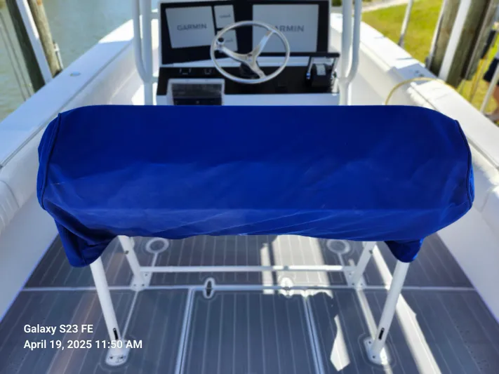  Yacht Photos Pics 2001 Jupiter 31 Open Center Console boat helm with blue cover and Garmin electronics.