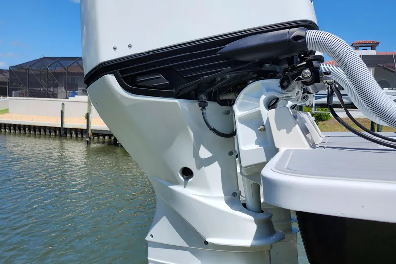  Yacht Photos Pics Outboard motor of a 2001 Jupiter 31 Open Center Console boat on water.