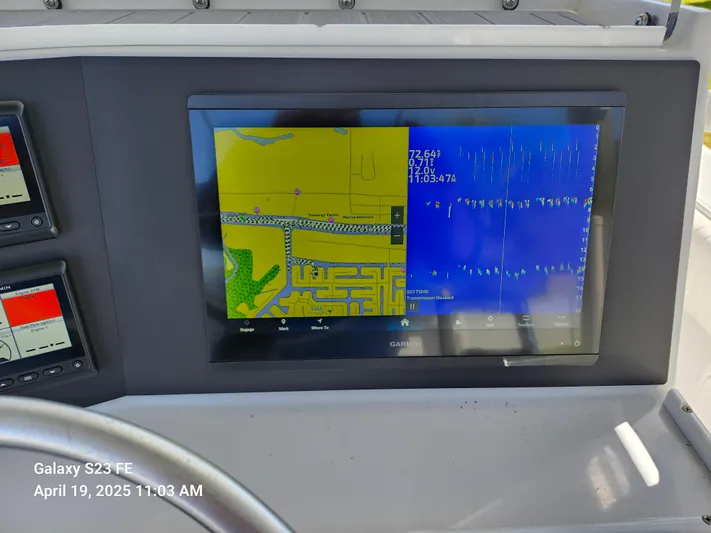  Yacht Photos Pics Close-up of a navigation display on a 2001 Jupiter 31 Open Center Console boat.