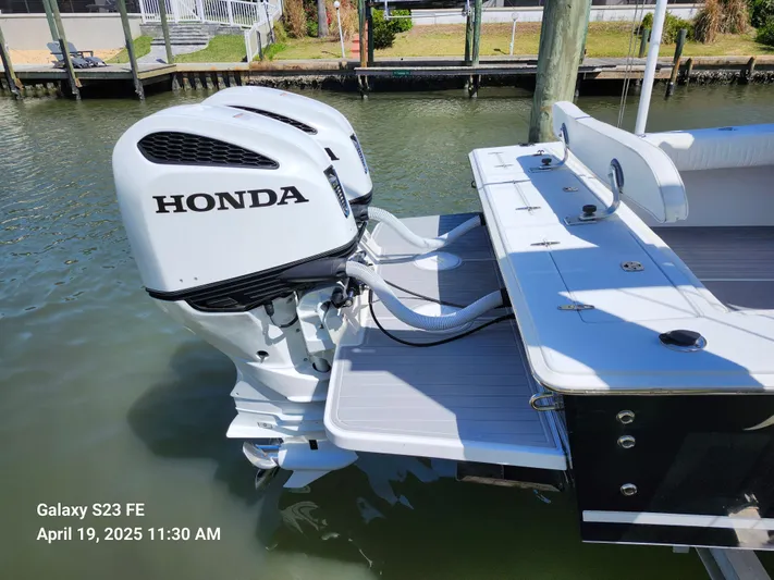  Yacht Photos Pics 2001 Jupiter 31 Open Center Console with Honda outboard engines docked in marina.
