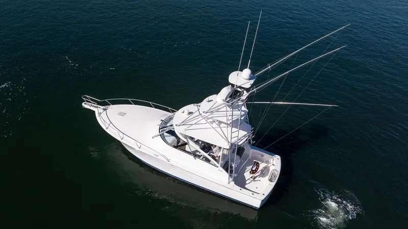  Yacht Photos Pics 2014 Viking 42 Open yacht cruising on calm waters, aerial view.