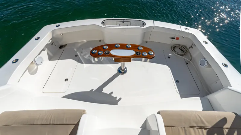 Yacht Photos Pics 2014 Viking 42 Open yacht deck with fishing rod holders, surrounded by calm water.