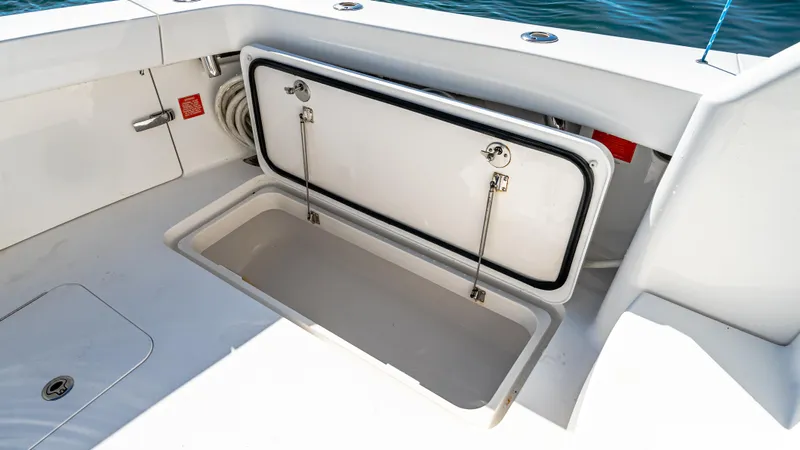  Yacht Photos Pics Open storage compartment on 2014 Viking 42 Open boat, showcasing spacious interior.