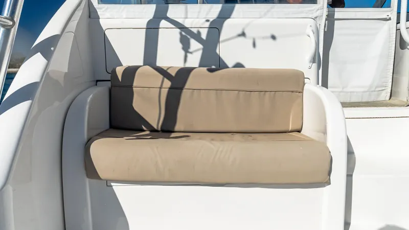  Yacht Photos Pics 2014 Viking 42 Open boat with beige cushioned seating on deck.