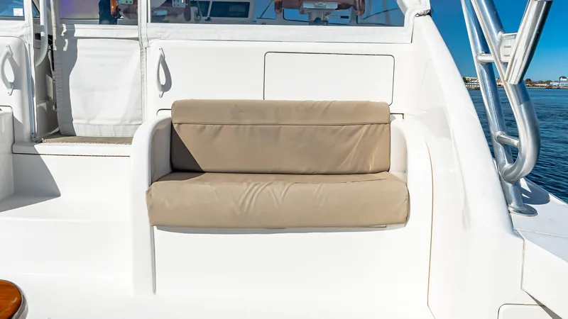  Yacht Photos Pics 2014 Viking 42 Open boat with beige cushioned seating on deck.