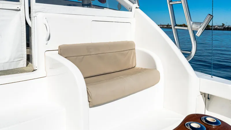  Yacht Photos Pics 2014 Viking 42 Open boat seating area with beige cushions and ocean view.