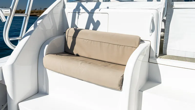  Yacht Photos Pics 2014 Viking 42 Open boat with beige cushioned seating on deck.