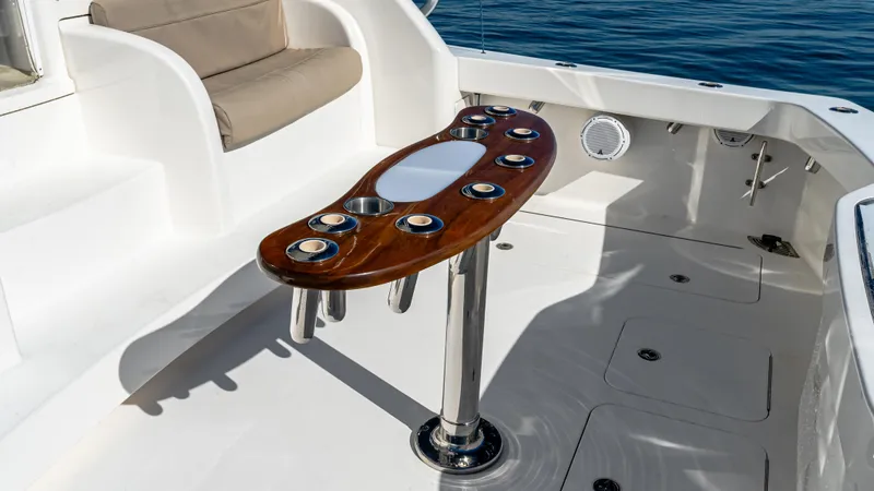  Yacht Photos Pics 2014 Viking 42 Open yacht cockpit with elegant wooden table and seating.