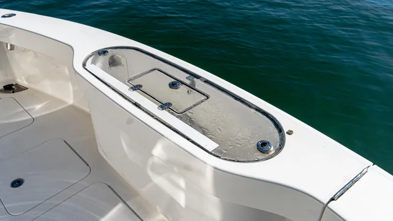  Yacht Photos Pics 2014 Viking 42 Open boat deck with livewell, near calm water.