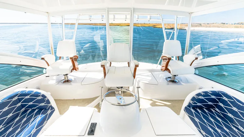  Yacht Photos Pics 2014 Viking 42 Open yacht interior with white seating and ocean view.