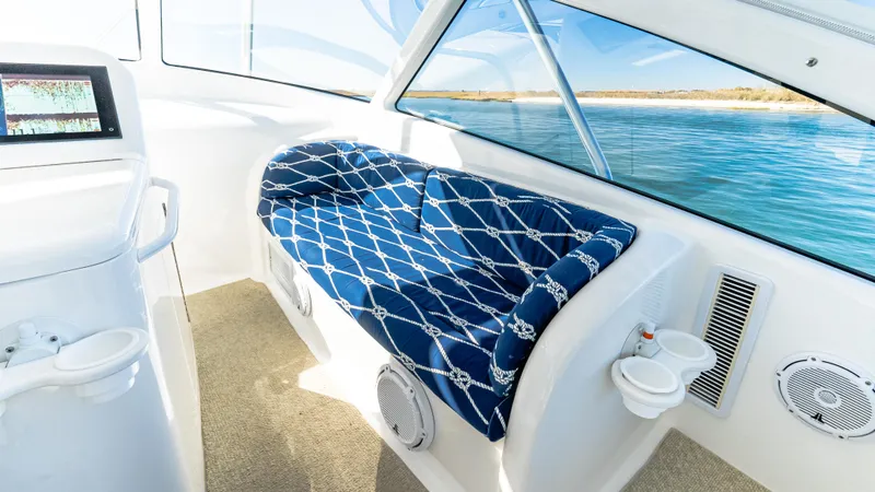  Yacht Photos Pics 2014 Viking 42 Open boat interior with blue cushioned seating and ocean view.