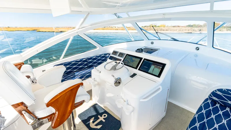  Yacht Photos Pics 2014 Viking 42 Open yacht helm with modern controls and ocean view.