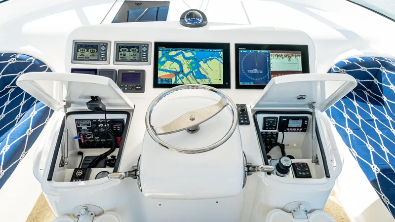  Yacht Photos Pics Helm of 2014 Viking 42 Open yacht with navigation screens and controls.