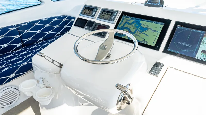  Yacht Photos Pics 2014 Viking 42 Open yacht helm with navigation screens and nautical-themed seating.