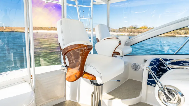 Yacht Photos Pics 2014 Viking 42 Open yacht interior with white seating and scenic water view.