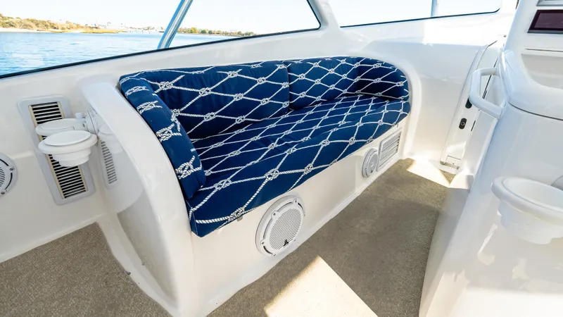  Yacht Photos Pics 2014 Viking 42 Open boat interior with blue patterned seating and white accents.
