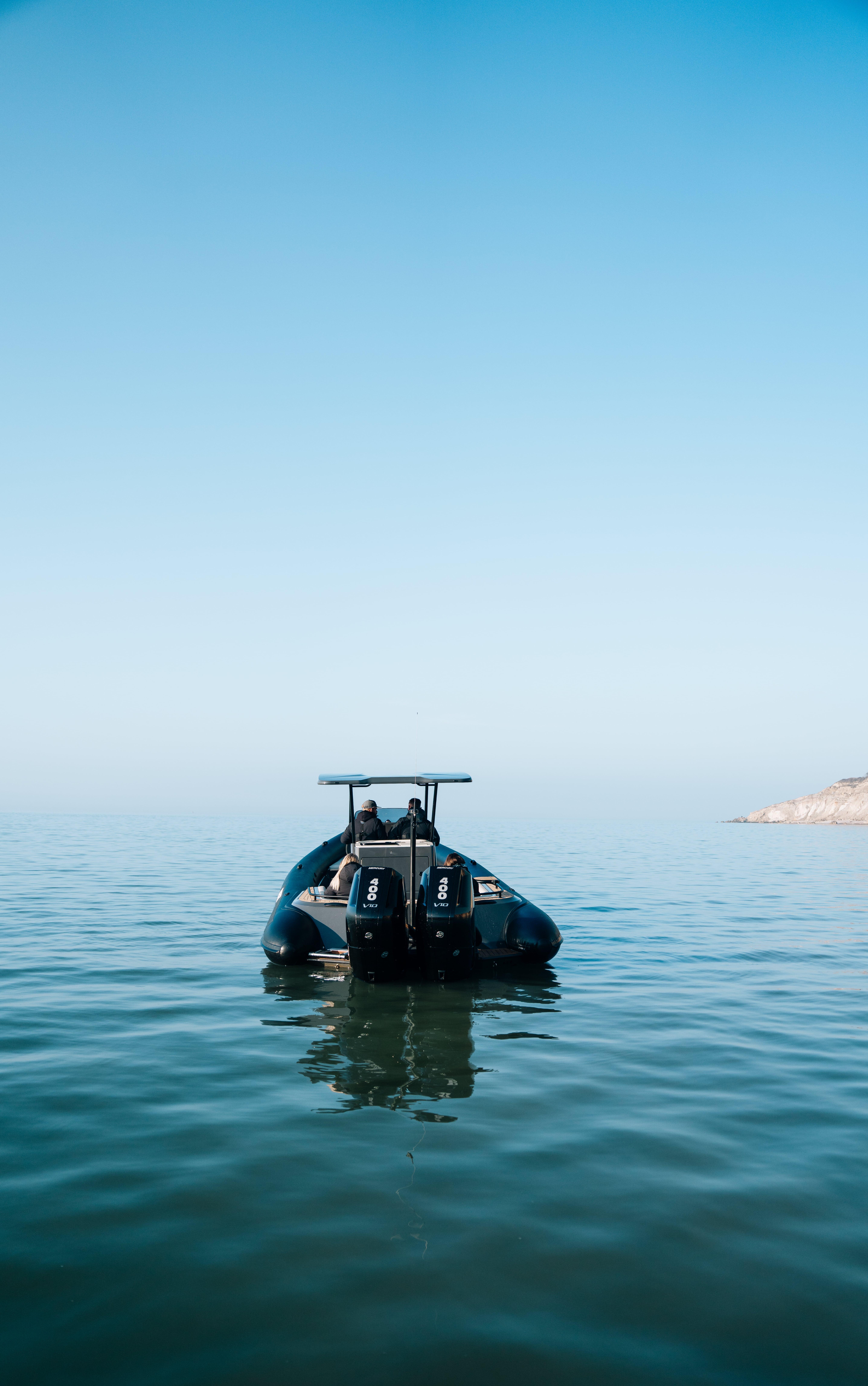 2025 Scorpion Grand Tourer 36 boat on calm sea under clear blue sky.