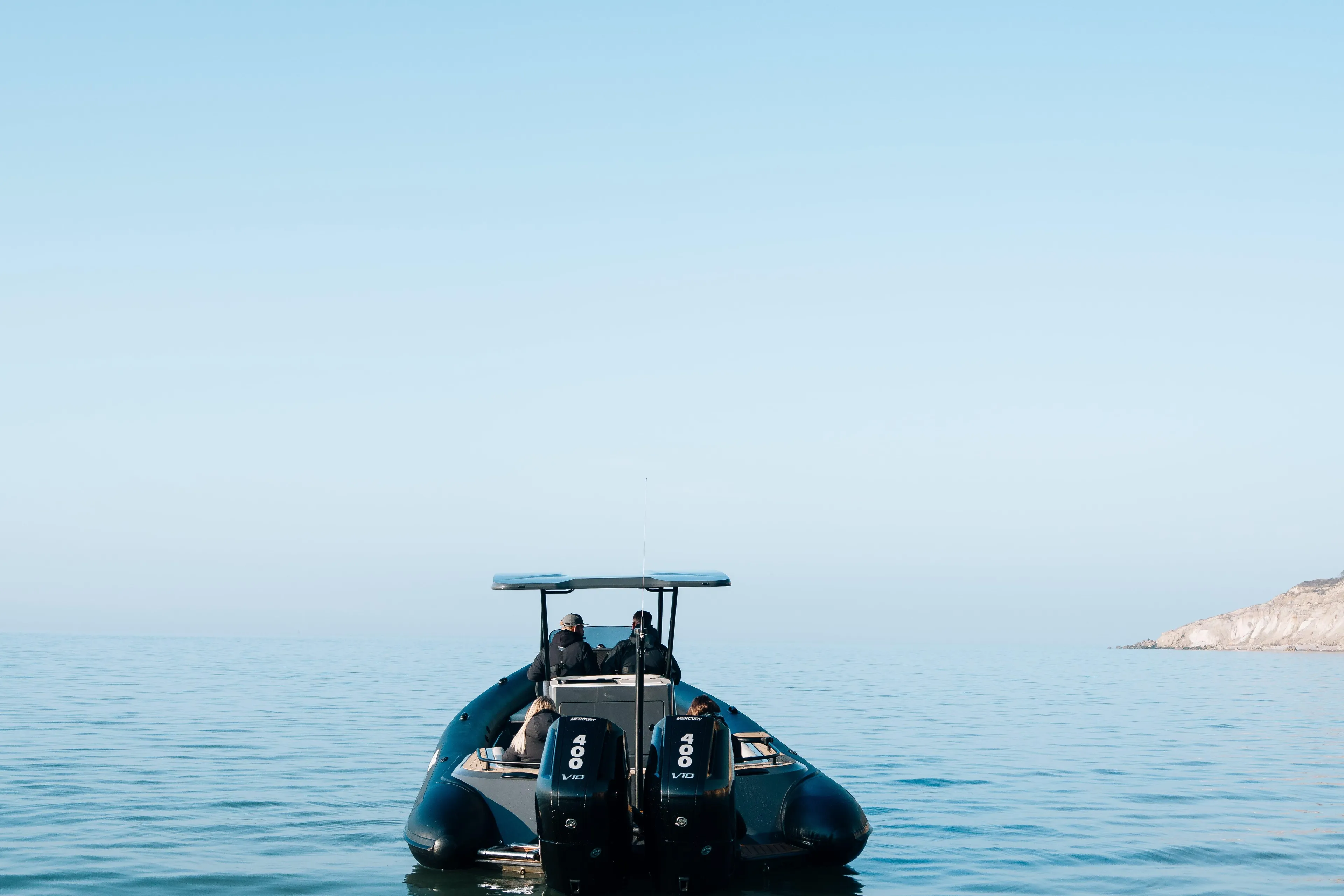 2025 Scorpion Grand Tourer 36 boat on calm sea under clear blue sky.