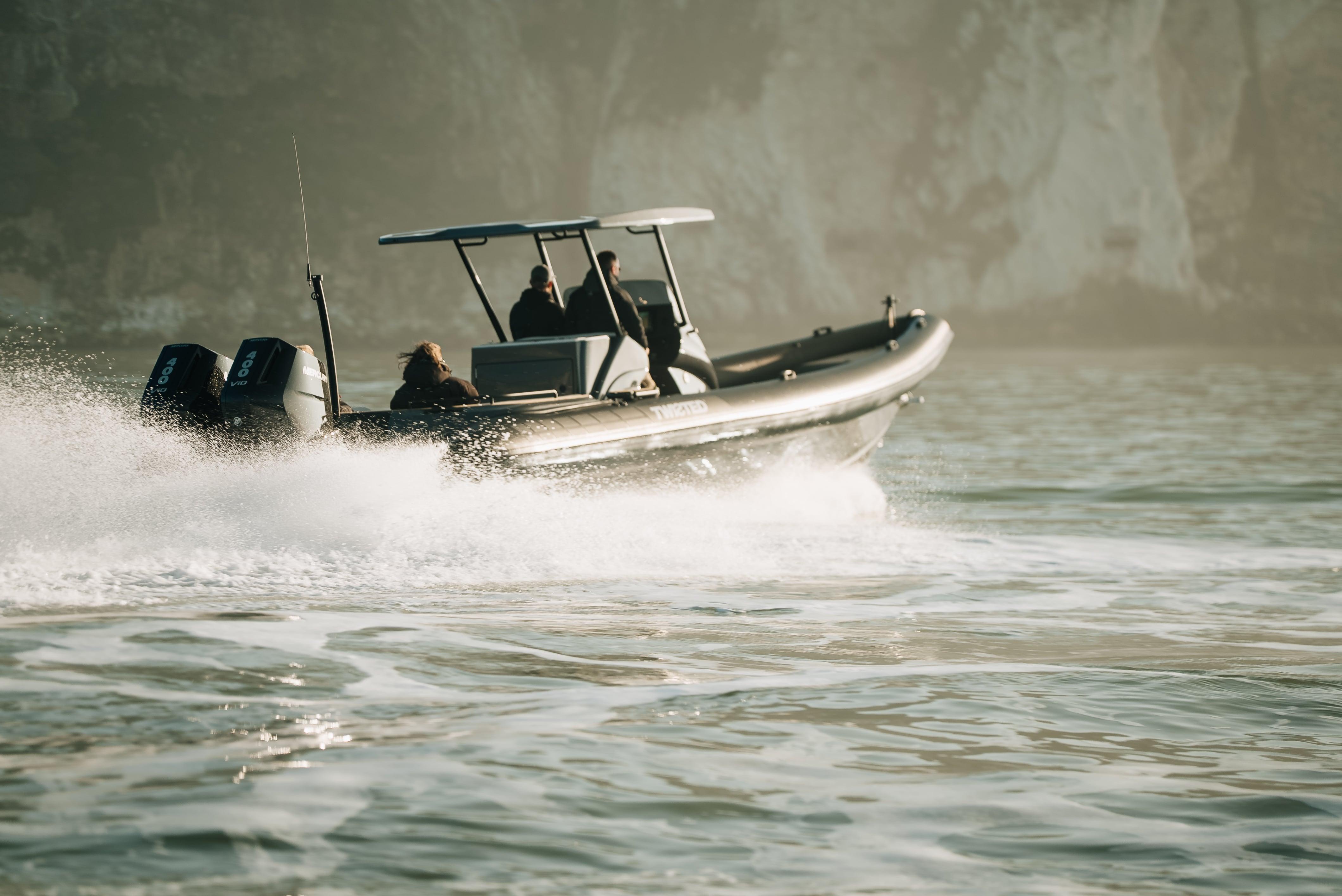 2025 Scorpion Grand Tourer 36 speeding on water, showcasing sleek design and powerful performance.