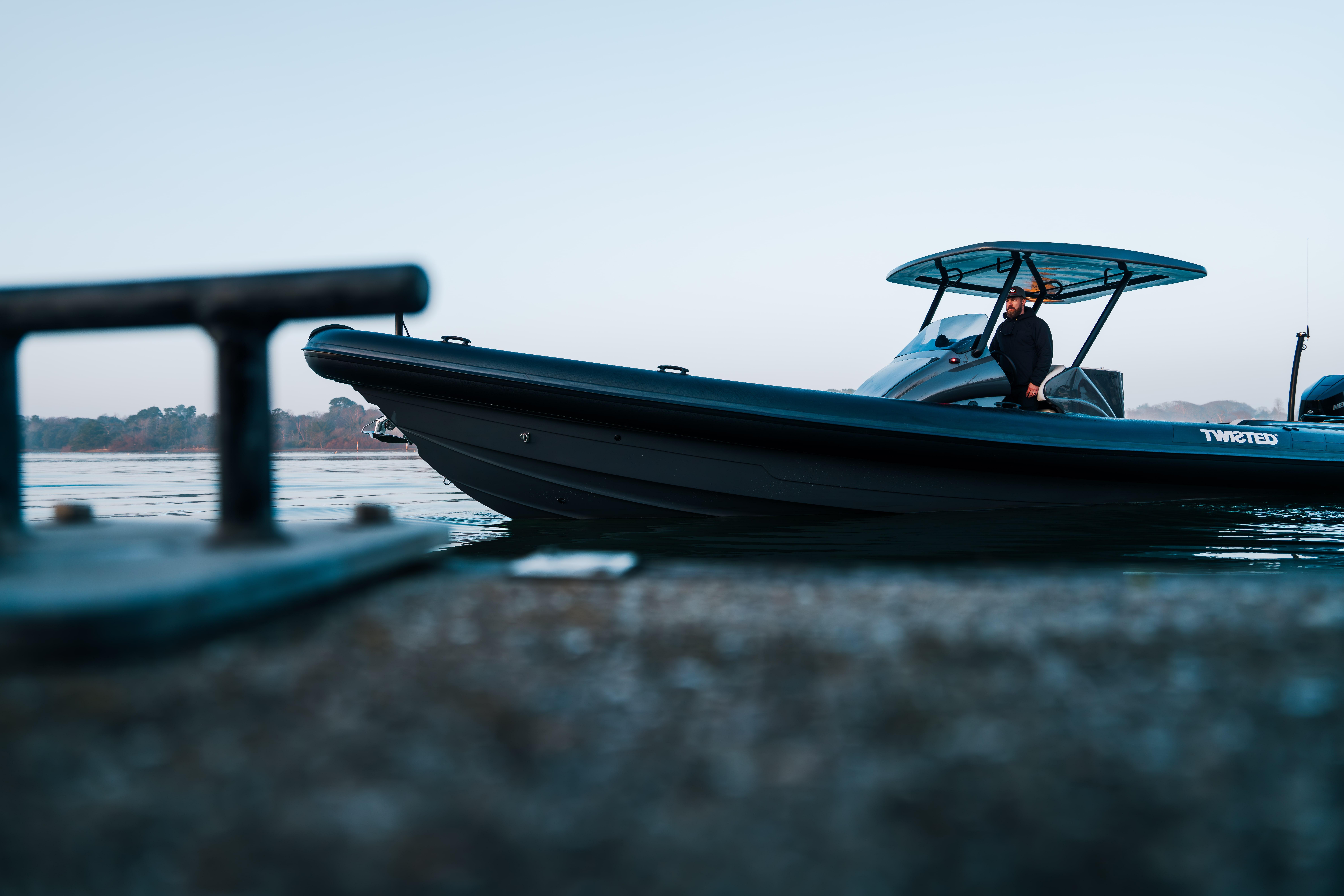 2025 Scorpion Grand Tourer 36 boat docked, sleek design, calm waters, side view.