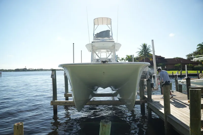  Yacht Photos Pics 2020 Tideline 365 Offshore boat docked, viewed from the front, with clear blue sky.