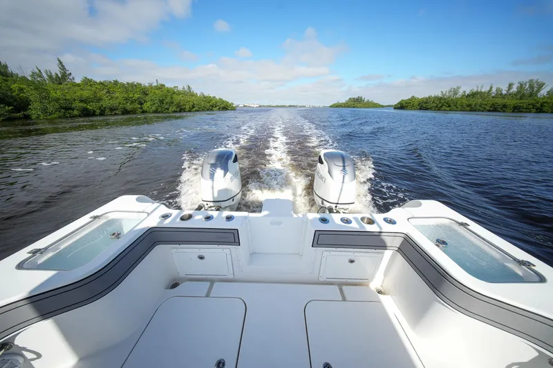  Yacht Photos Pics 2020 Tideline 365 Offshore boat cruising on a sunny day, twin engines visible.