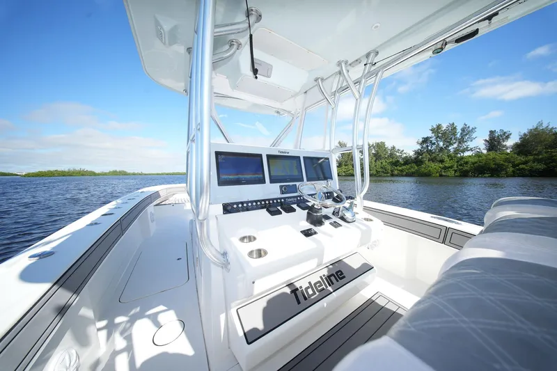  Yacht Photos Pics 2020 Tideline 365 Offshore boat interior with modern navigation system on a sunny day.