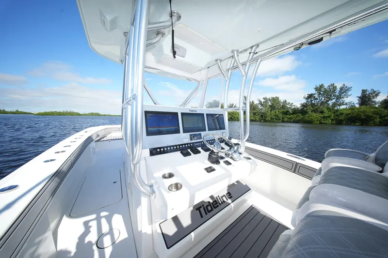  Yacht Photos Pics 2020 Tideline 365 Offshore boat interior with modern navigation system on a sunny day.