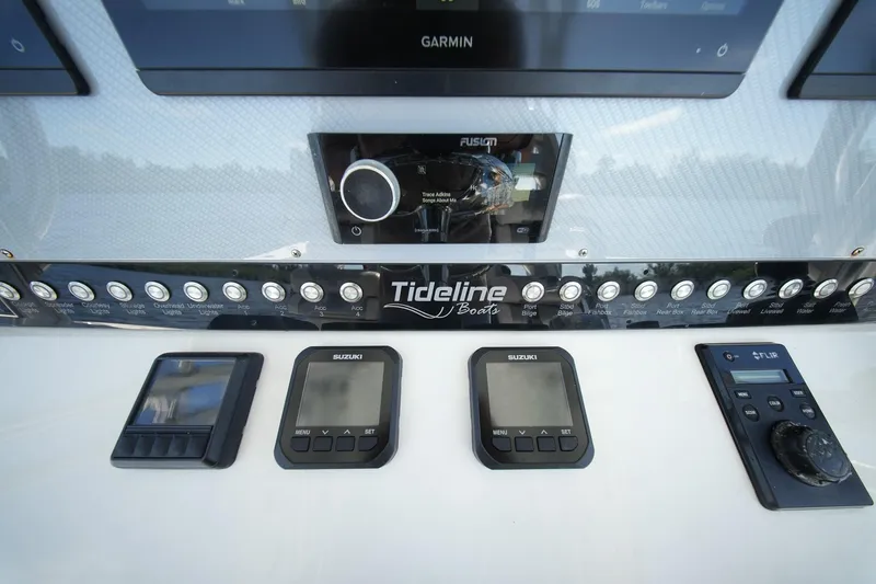  Yacht Photos Pics Control panel of 2020 Tideline 365 Offshore boat with Suzuki and Garmin displays.