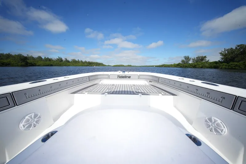  Yacht Photos Pics 2020 Tideline 365 Offshore boat on calm water under blue sky.