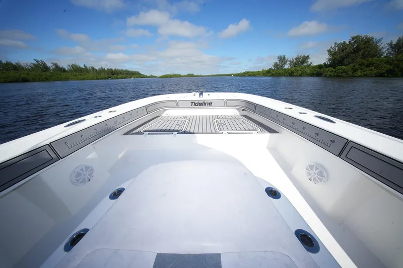  Yacht Photos Pics 2020 Tideline 365 Offshore boat on calm water under a clear blue sky.
