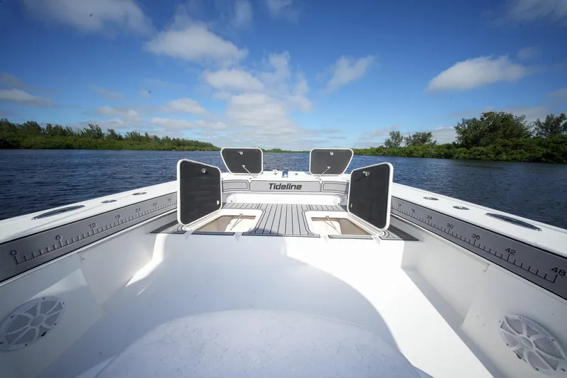  Yacht Photos Pics 2020 Tideline 365 Offshore boat on calm water under blue sky.